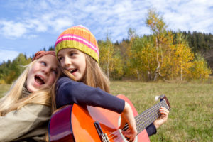 Two Girls Playing Guitar