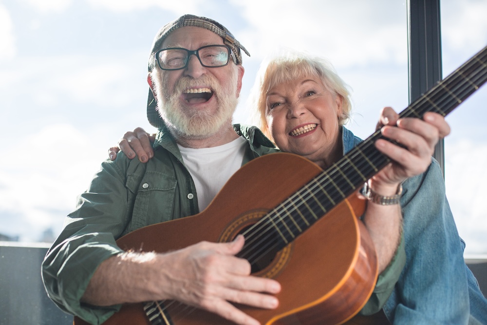 Older person playing guitar